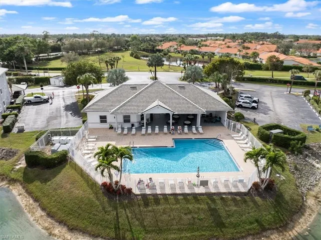 View of pool featuring a patio and a water view