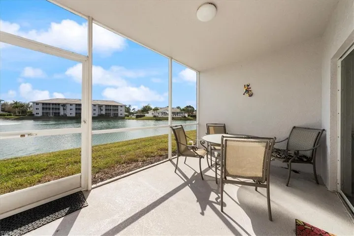 Sunroom / solarium with a water view