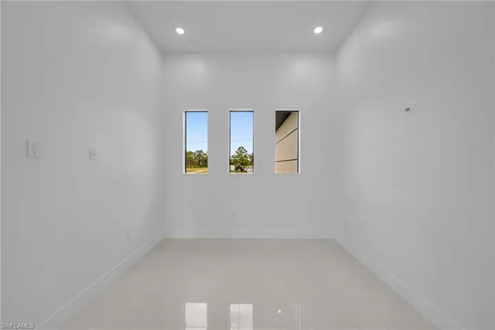 Spare room with recessed lighting and light tile patterned flooring