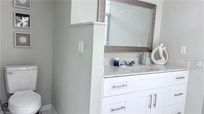 Bathroom featuring vanity and toilet