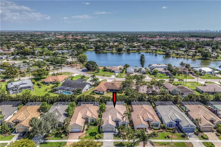 Drone / aerial view with a water view and a residential view