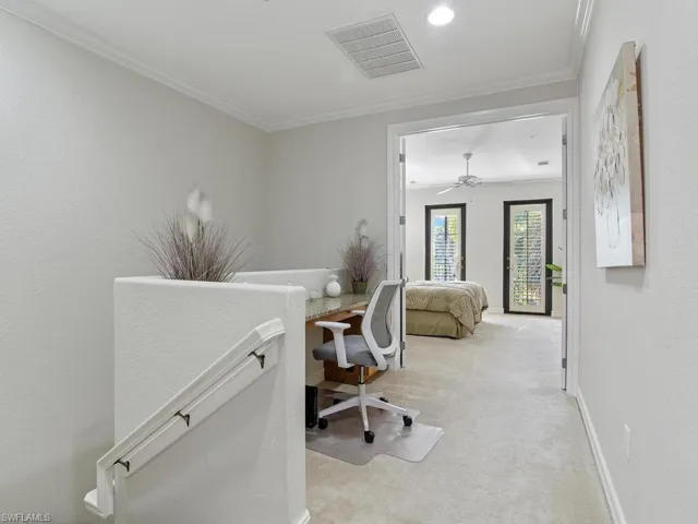 Office with light carpet, ornamental molding, and ceiling fan