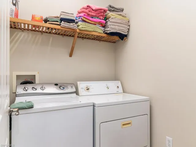 Washroom featuring independent washer and dryer