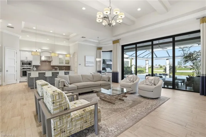 Coffered ceiling, tile throughout, and sliders that pocket to allow the indoor/outdoor lifestyle