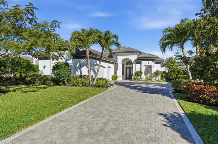 This home features 3 car garage and a long paved driveway