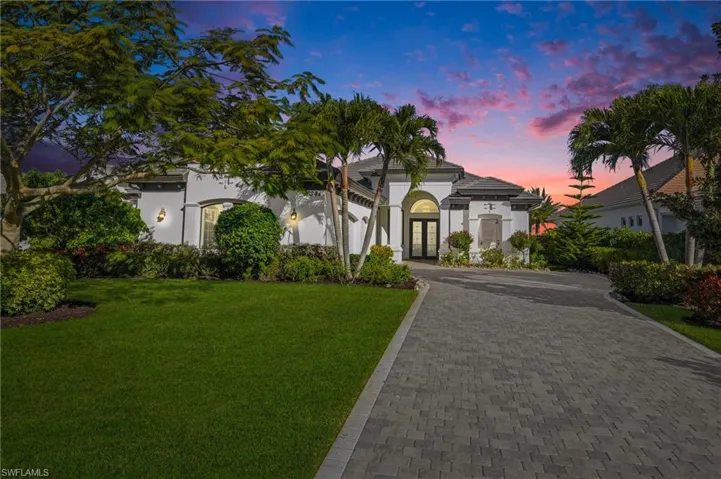 Welcome home to this custom Harbourside home in Talis Park