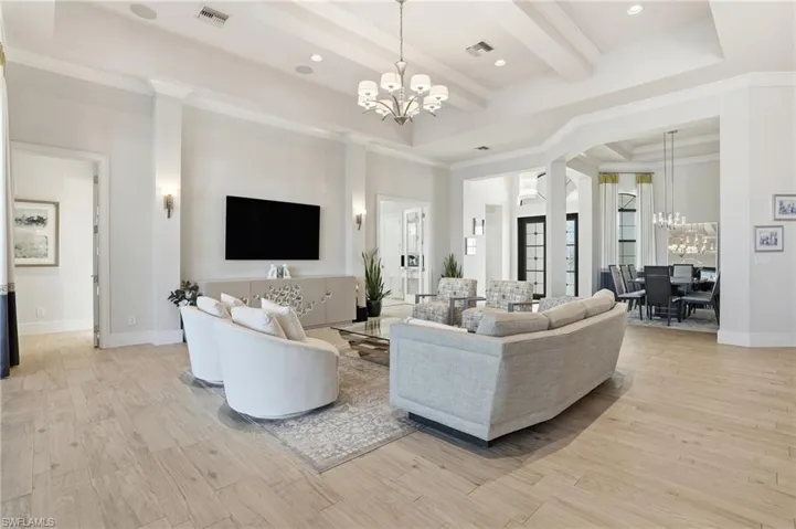 The formal dining room is adjacent to the great room with columns to frame the space