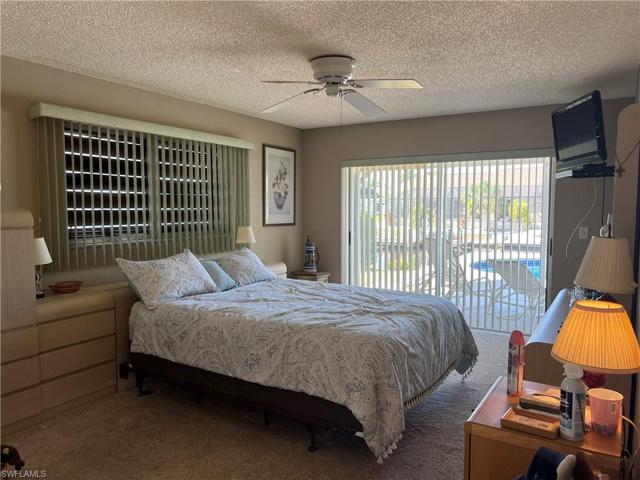 Primary Bedroom overlooks the pool and canal.