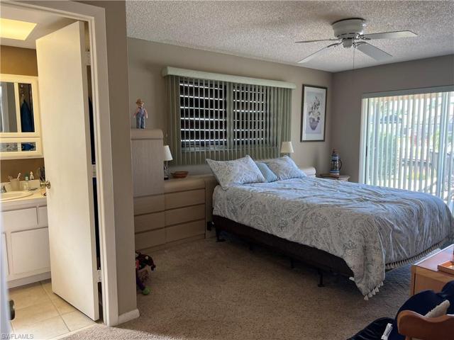 Primary Bedroom overlooks the pool and canal.
