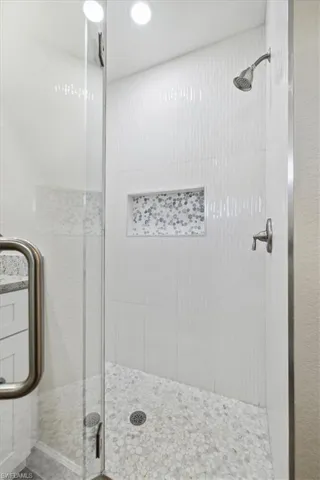 Bathroom with a shower with door