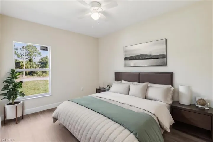Bedroom featuring hardwood / wood-style flooring and ceiling fan