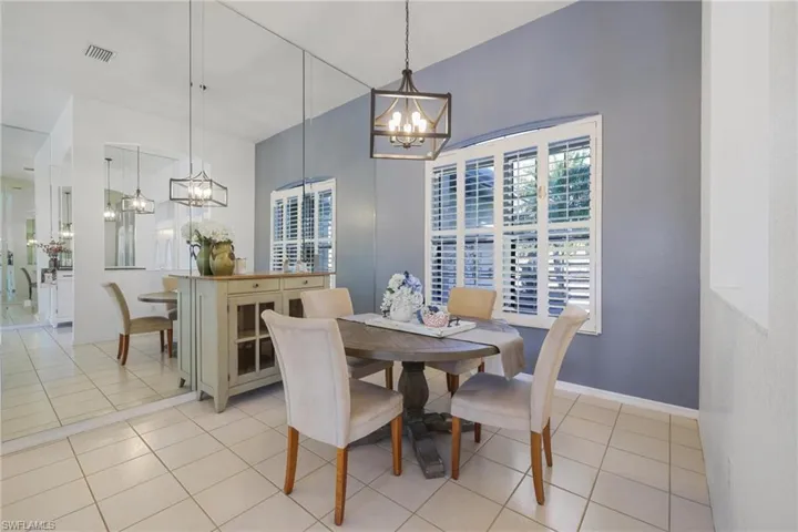 Dining space featuring a chandelier and light tile patterned flooring
