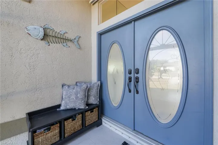 Entrance to property featuring stucco siding
