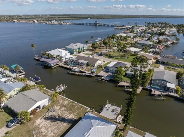 Aerial perspective of suburban area with a nearby body of water