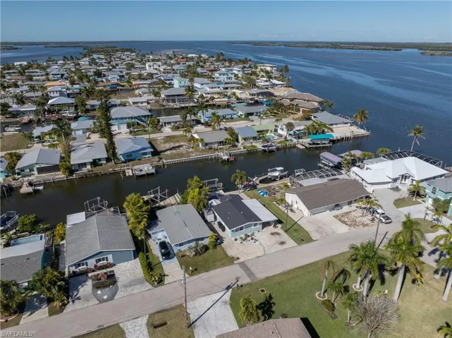 Aerial overview of property's location featuring nearby suburban area and a large body of water