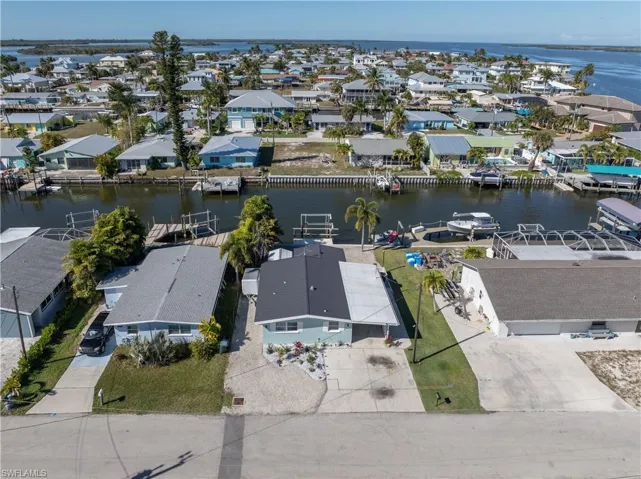 Aerial view of residential area with a nearby body of water
