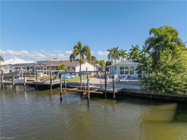 Dock with boat lift and a water view