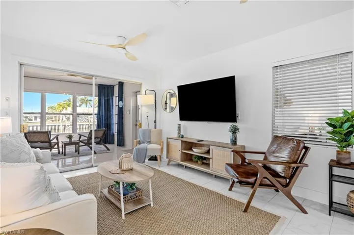Living area featuring ceiling fan