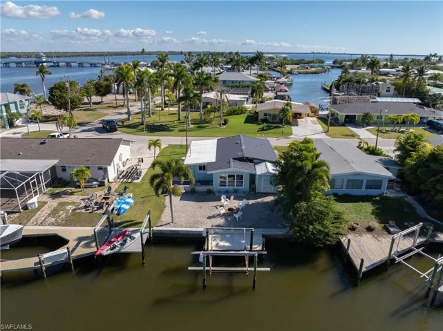 Aerial perspective of suburban area with a large body of water