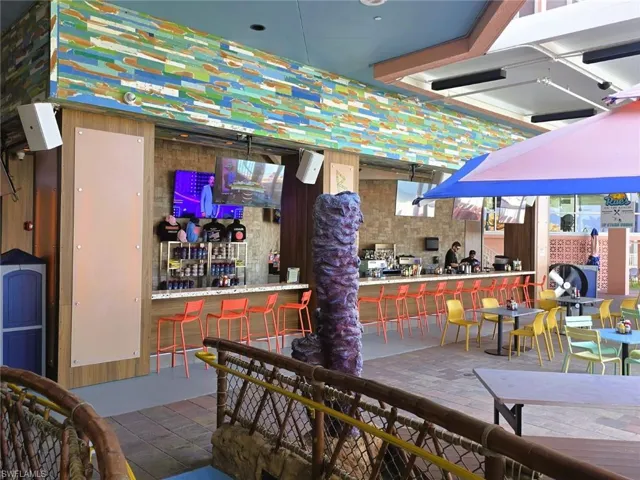 View of patio featuring an outdoor bar