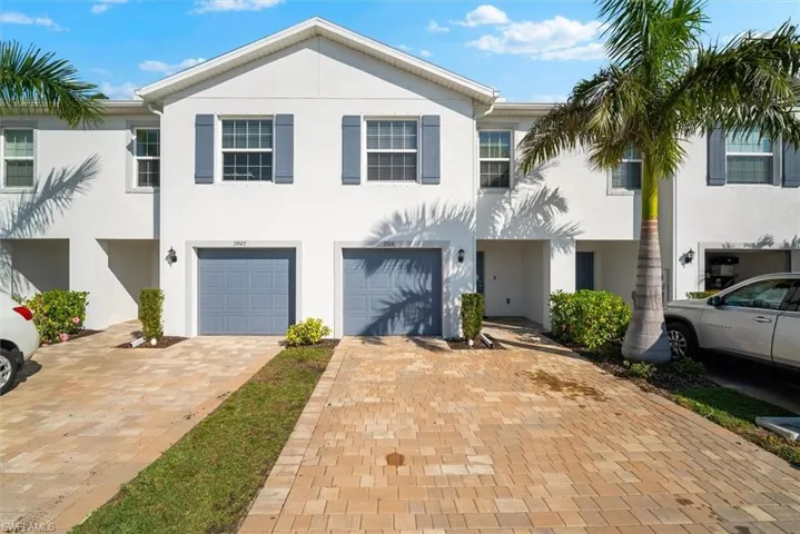 View of property with a garage