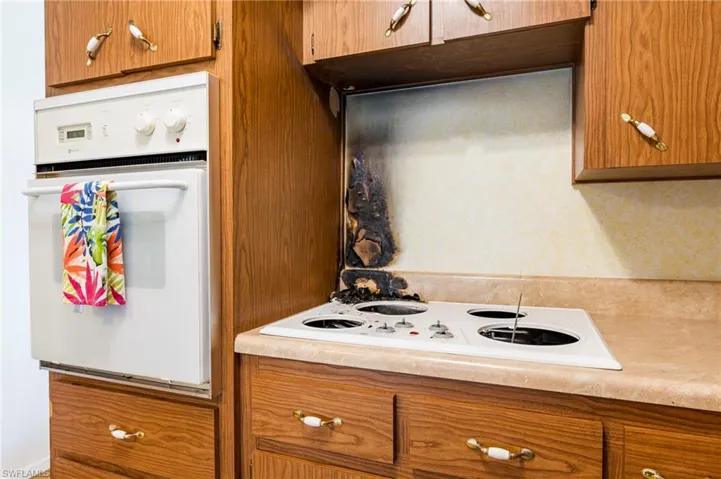 Kitchen featuring white appliances