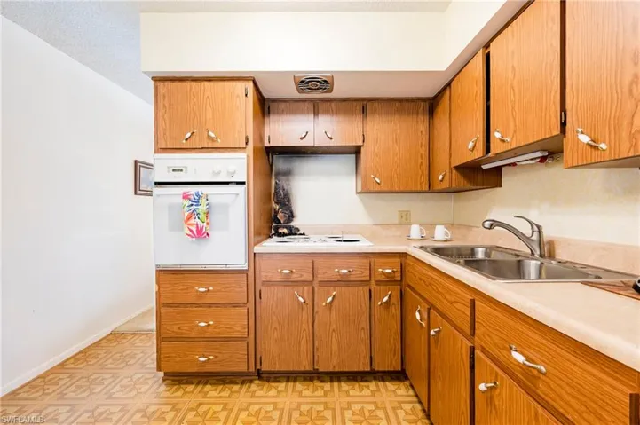 Kitchen with sink and white appliances