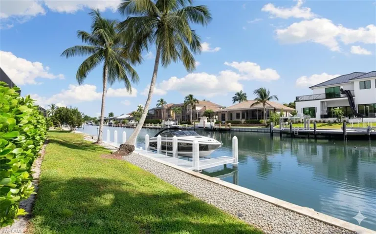 Rendering of what a boat dock and boat could look like behind this house