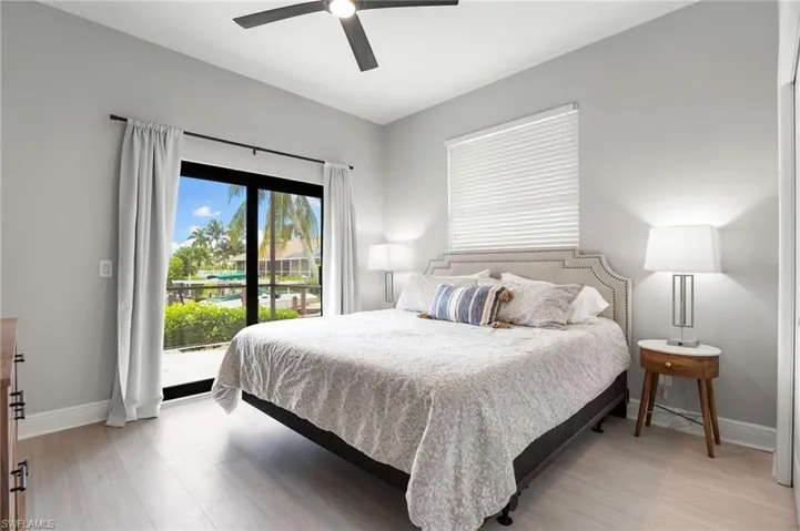 Guest bedroom #2 has a large patio door leading to the back pool lanai