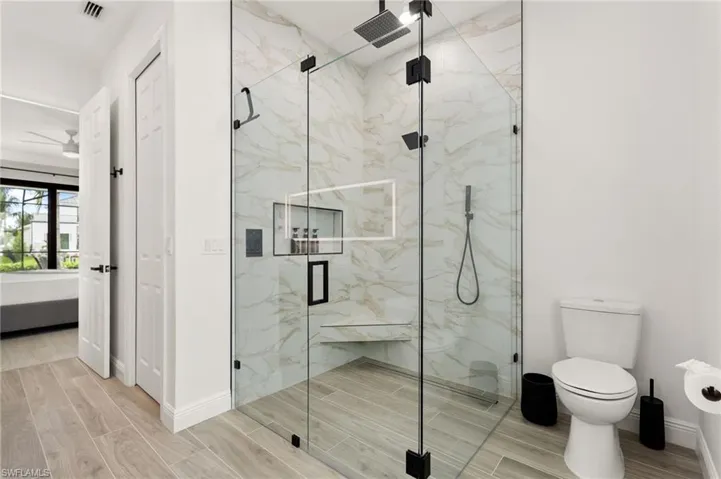 Master bathroom has a massive shower with multiple shower heads has been fully renovated