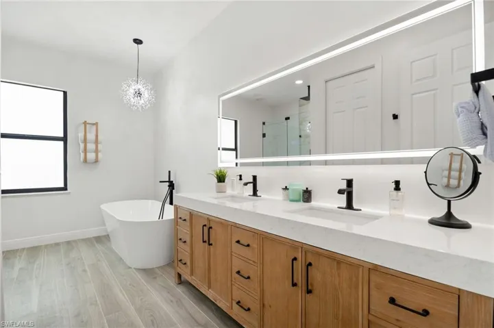 Master bathroom with double sinks and separate soaking tub has been fully renovated