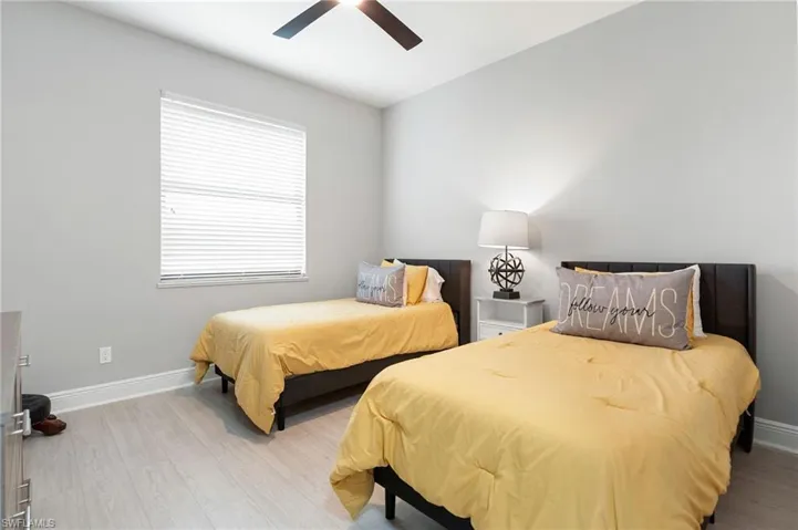 Guest bedroom #3 with dual twin beds and lots of natural light