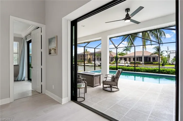 Living Room pocket sliding doors to the covered lanai and pool