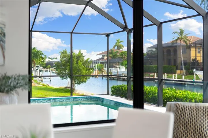 View from the dining room over the pool and canal