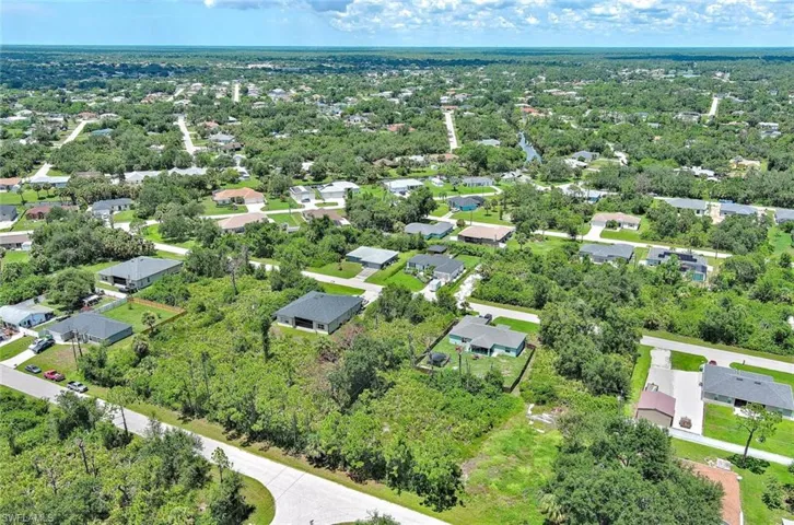 Aerial view of residential area with a tree filled landscape