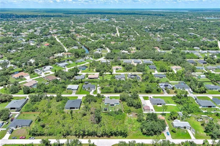 View of property location with nearby suburban area