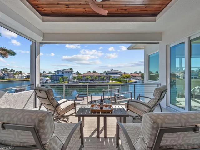 View of patio / terrace featuring a water view and a balcony