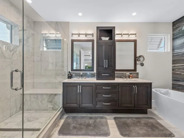 Bathroom with vanity and independent shower and bath