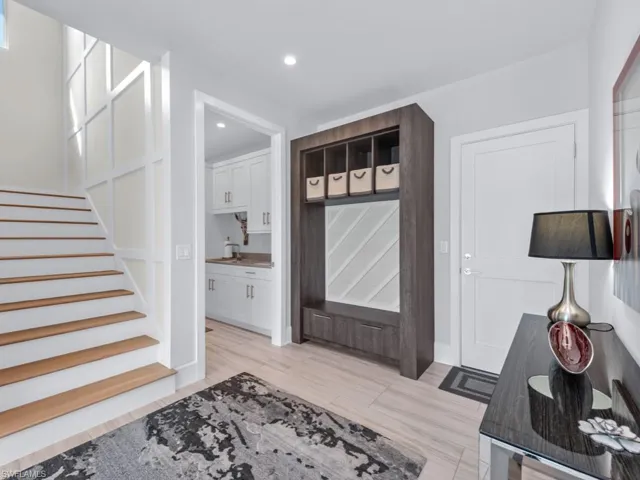 Mudroom with light hardwood / wood-style floors