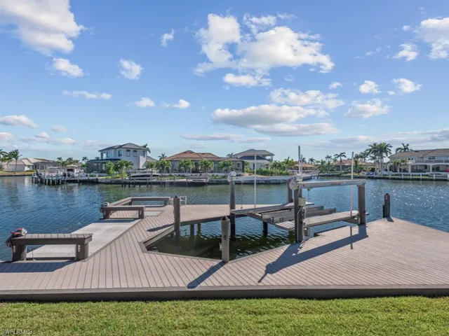 Dock area featuring a water view