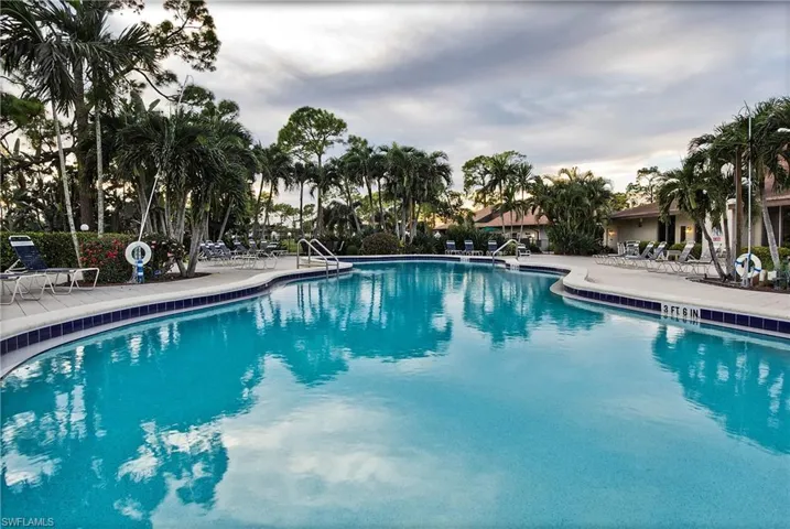 Community pool featuring a patio
