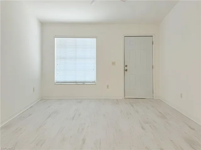 Unfurnished room featuring light wood-type flooring