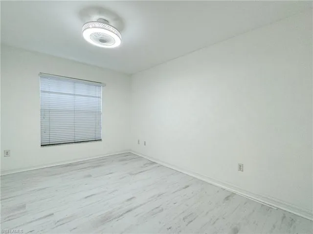 Spare room featuring light wood-type flooring