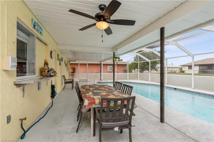 LARGE COVERED AREA WITH A LARGE POOL