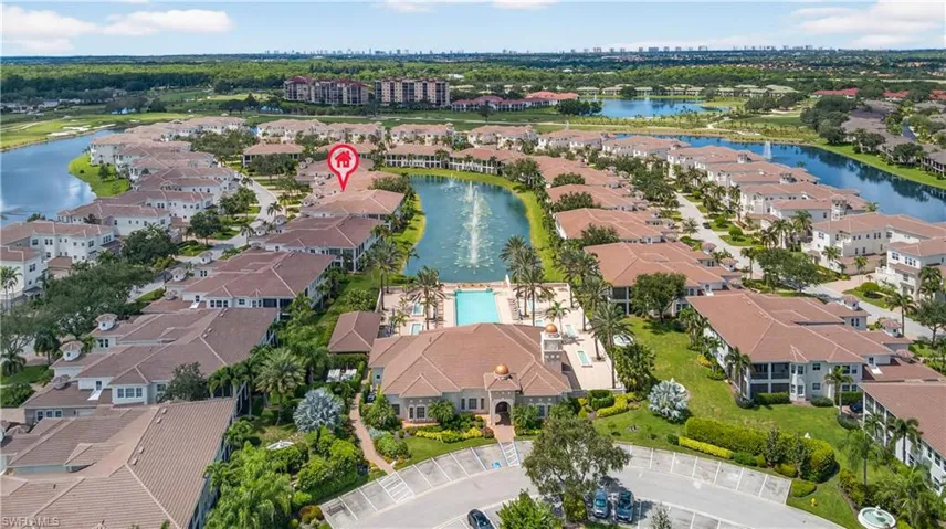 Aerial view of property's location with a nearby body of water