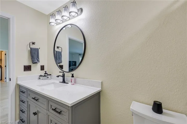 Bathroom with vanity and toilet