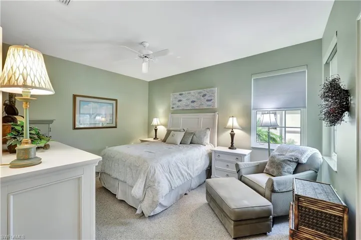 Carpeted bedroom with ceiling fan