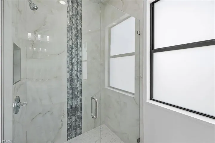 Bathroom with an enclosed shower