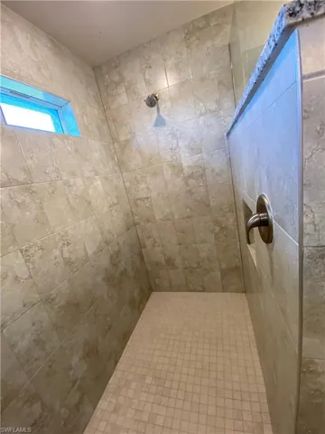 Bathroom with a tile shower