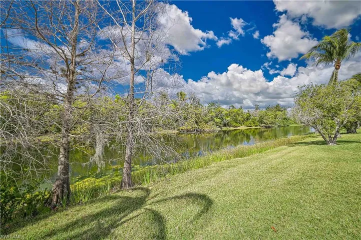 View of grassy yard featuring a water view
